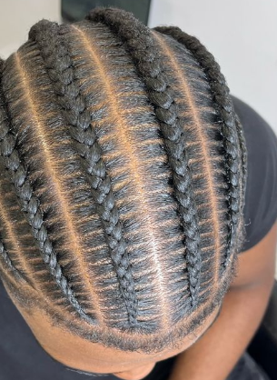 Clean stitch braids styled for men