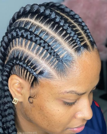 Client wearing neatly finished braids styled at Miriam African Hair Braiding